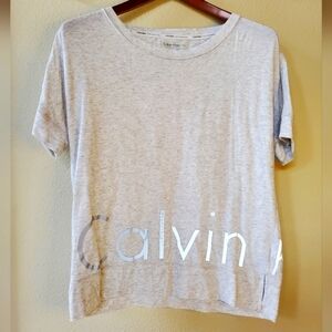 Calvin Klein Womens performance Tee. Gray with reflective logo. SIZE S